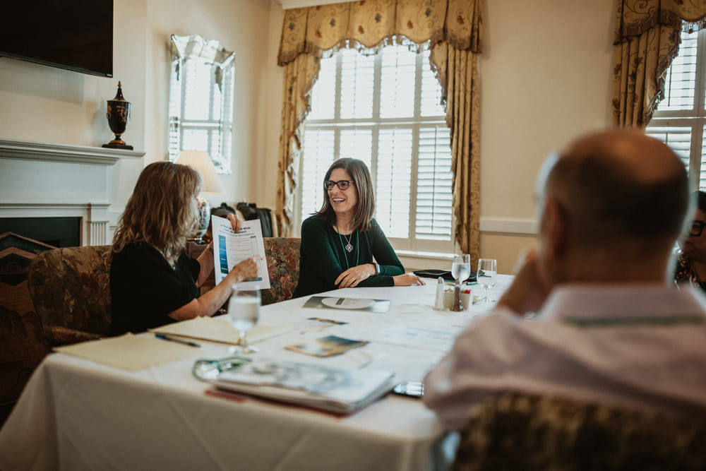 Creative business owners reviewing financial performance and profitability during a business strategy session